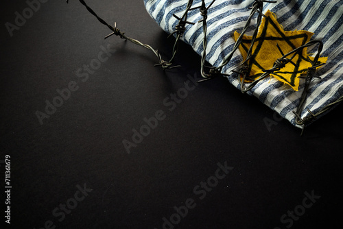 Fotografie Jewish prisoner with yellow badge on dark background