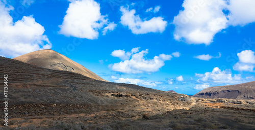Spectacular view of the Fire Mountains at Timanfaya National Park, this unique area consisting entirely of volcanic soils. Volcanic landscape in a sea of ​​lava. Tourism and vacation. Lanzarote, Spain