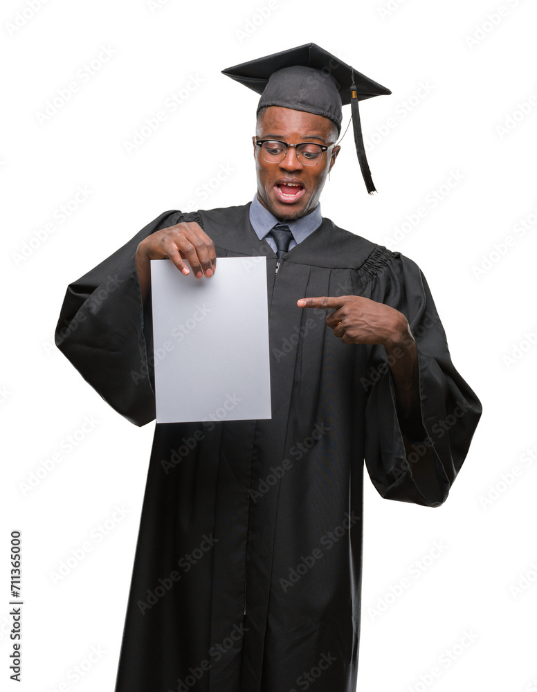 Young graduated african american man holding blank paper degree over isolated background very happy pointing with hand and finger Young graduated african american man holding blank paper degree over isolated background very happy pointing with hand and finger