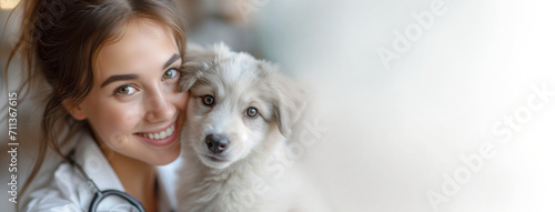 Banner of doctor portrait and small white dog in the hands of a veterinarian. Caring for animals. Concept for International Veterinarian Day photo