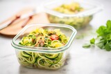 zoodles in a glass meal prep container