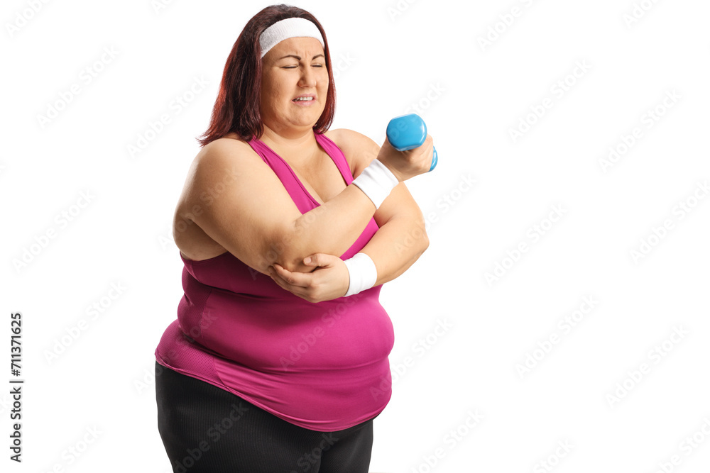 Plus size woman in sportswear suffering from pain in the elbow Plus size woman in sportswear suffering from pain in the elbow
