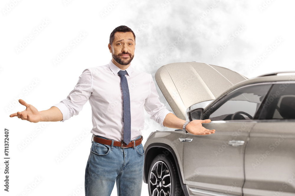 Angry driver standing in front of a SUV with an open hood Angry driver standing in front of a SUV with an open hood