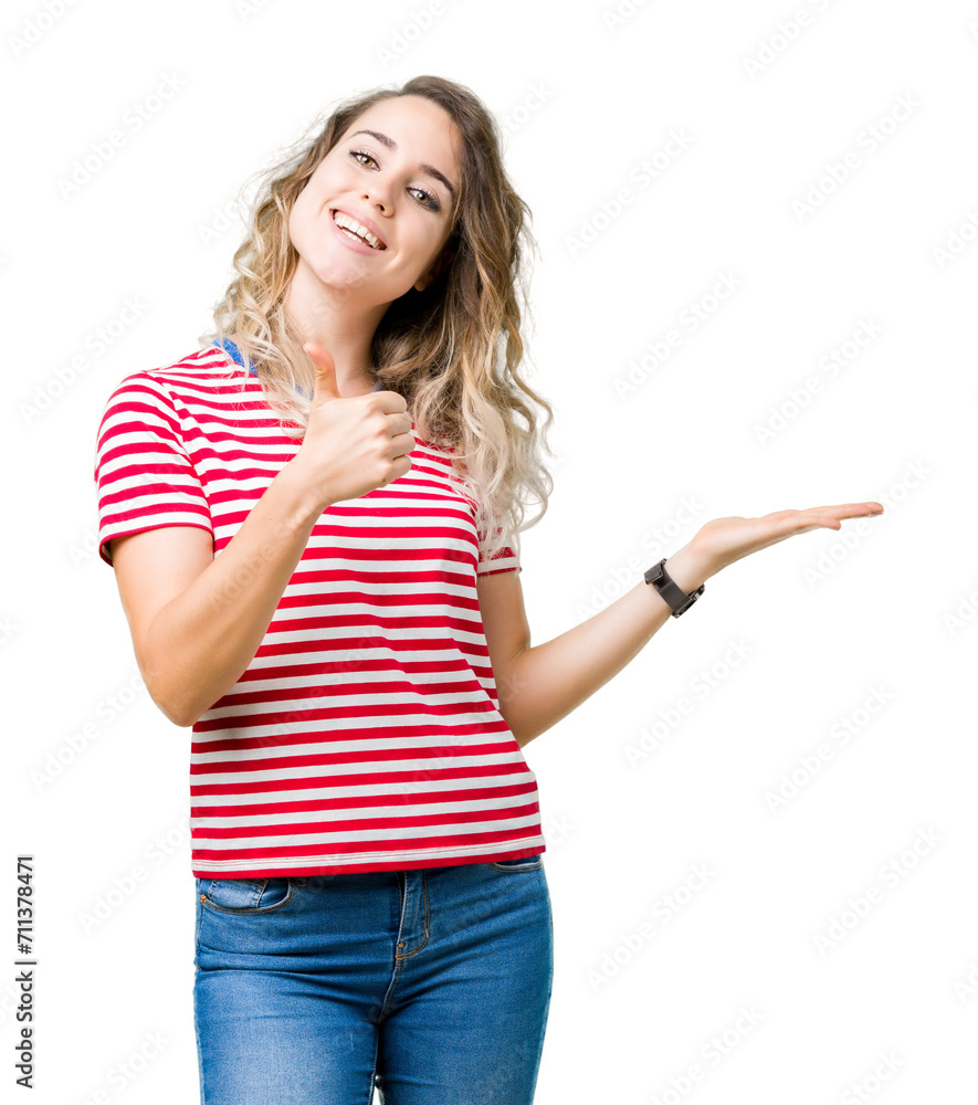 Beautiful young blonde woman over isolated background Showing palm hand and doing ok gesture with thumbs up, smiling happy and cheerful Beautiful young blonde woman over isolated background Showing palm hand and doing ok gesture with thumbs up, smiling happy and cheerful