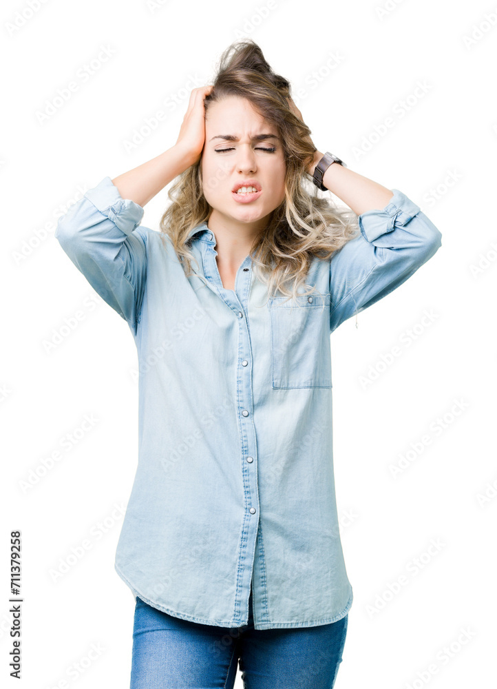 Beautiful young blonde woman over isolated background suffering from headache desperate and stressed because pain and migraine. Hands on head. Beautiful young blonde woman over isolated background suffering from headache desperate and stressed because pain and migraine. Hands on head.