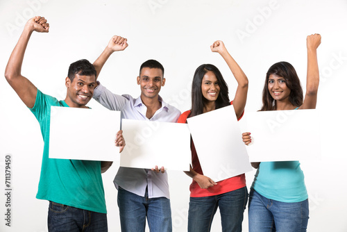 Group of Indian people with a banner ad. photo