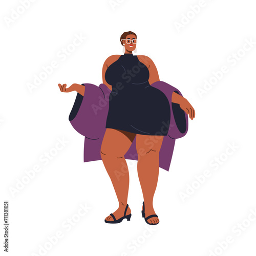 Happy fat body-positive woman posing in short mini dress. Young plus-size fem...