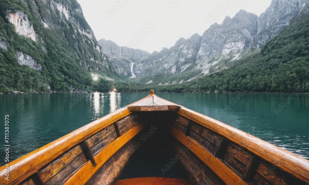 Fototapeta premium Wooden Boat on Serene Mountain Lake at Dusk