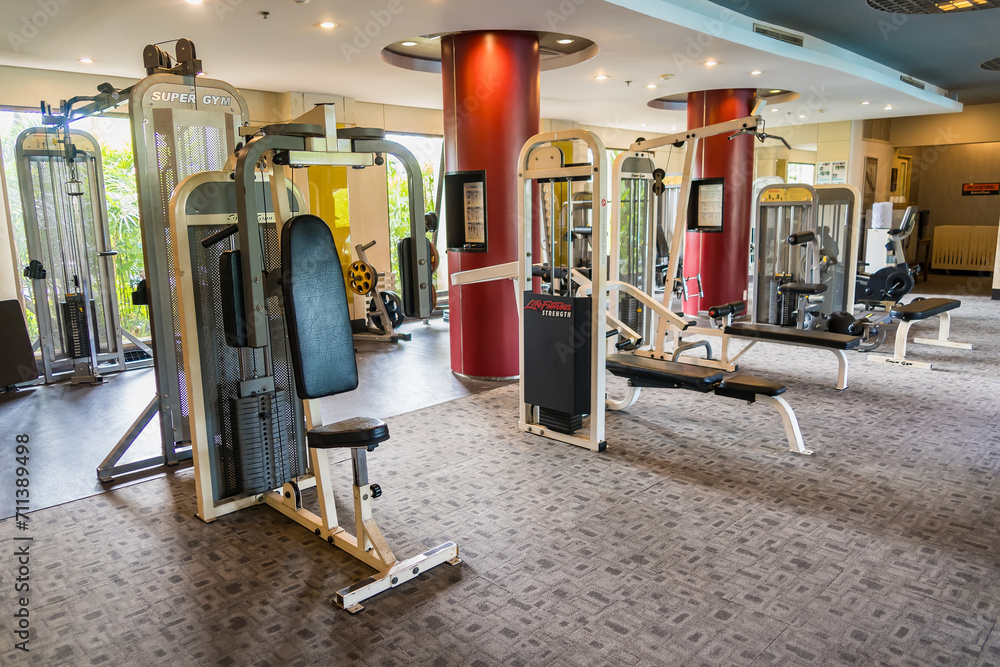 Sports simulators equipment in interior of the gym at CHONBURI, THAILAND. Sports simulators equipment in interior of the gym at CHONBURI, THAILAND.