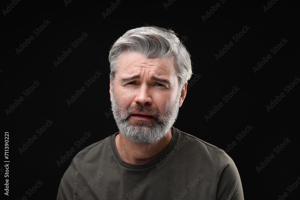 Personality concept. Portrait of emotional man on black background Personality concept. Portrait of emotional man on black background