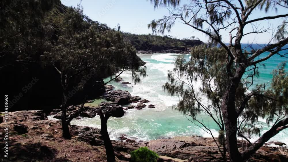 Idyllic Beach With Foamy Ocean Waves And Tropical Vegetation In Noosa, Queensland, Australia - Drone Pullback Idyllic Beach With Foamy Ocean Waves And Tropical Vegetation In Noosa, Queensland, Australia - Drone Pullback