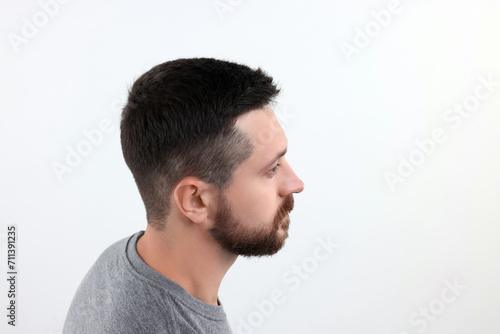Man with healthy hair on white background. Space for text