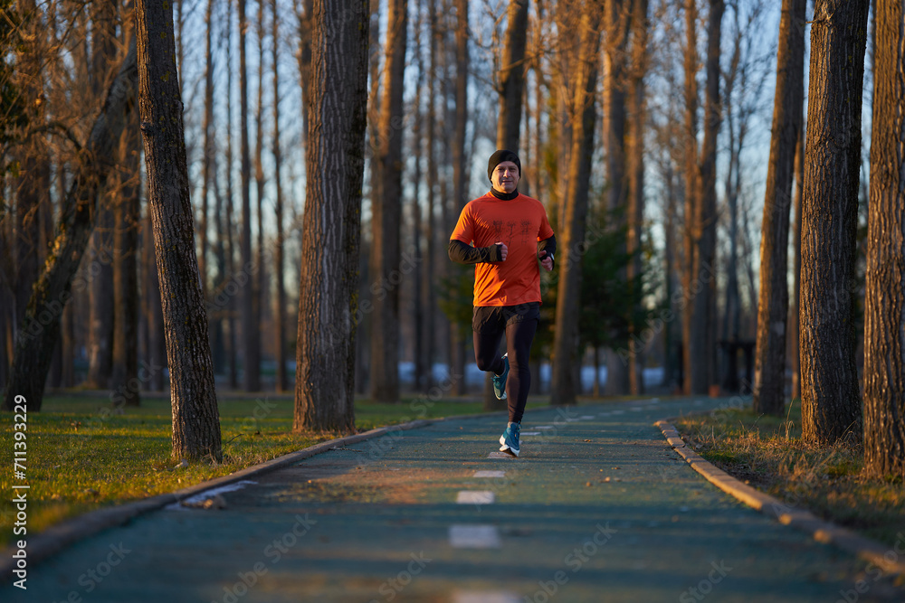 Man running in the park in wintertime