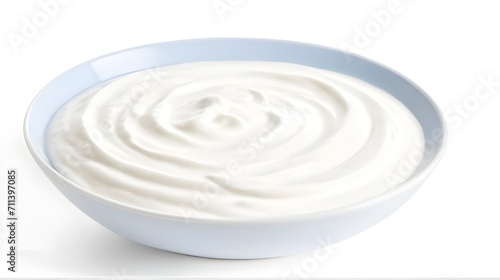 Sour cream yogurt with basil leaves in a white bowl white background photo