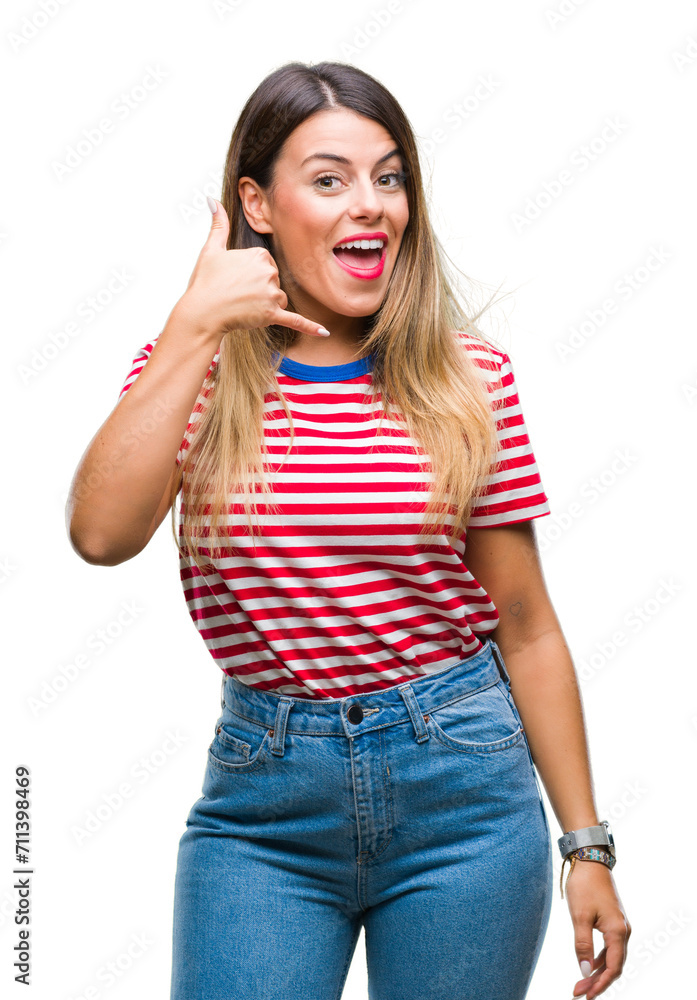 Young beautiful woman casual look over isolated background smiling doing phone gesture with hand and fingers like talking on the telephone. Communicating concepts. Young beautiful woman casual look over isolated background smiling doing phone gesture with hand and fingers like talking on the telephone. Communicating concepts.