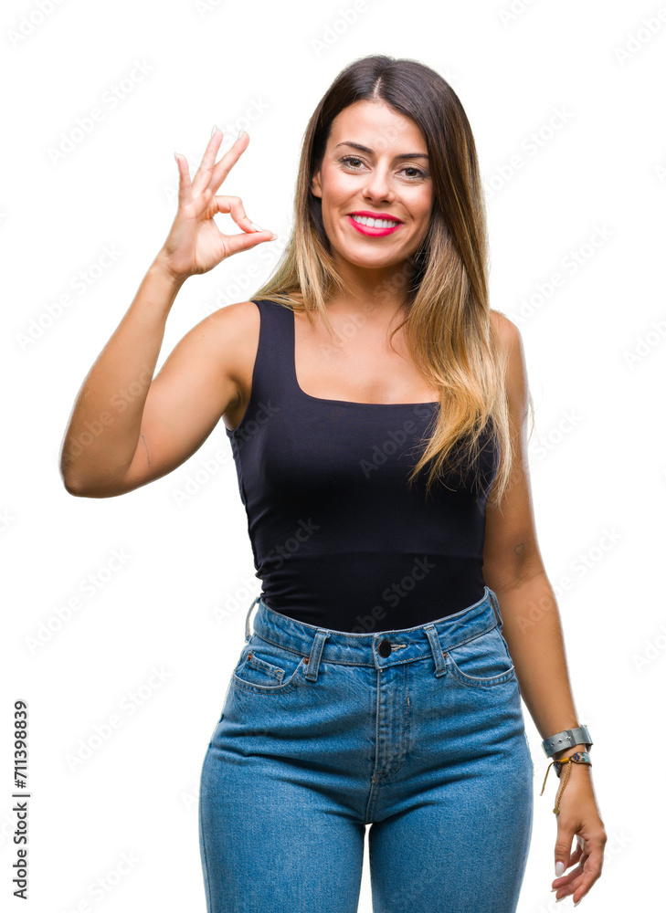 Young beautiful woman over isolated background smiling positive doing ok sign with hand and fingers. Successful expression. Young beautiful woman over isolated background smiling positive doing ok sign with hand and fingers. Successful expression.