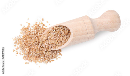 Scoop with dry wheat groats isolated on white, top view