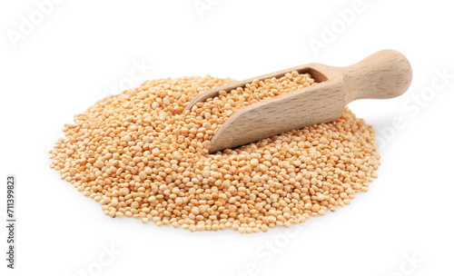 Wooden scoop with raw quinoa isolated on white