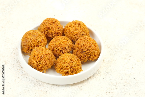 Kremes Ubi or kue cakar ayam is Sweet Potatoes Crunchy Cake made from Grated Sweet Potatoes and Sugar. Indonesian Traditional Snack photo