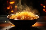 A bowl of ramen noodles with steam rising.