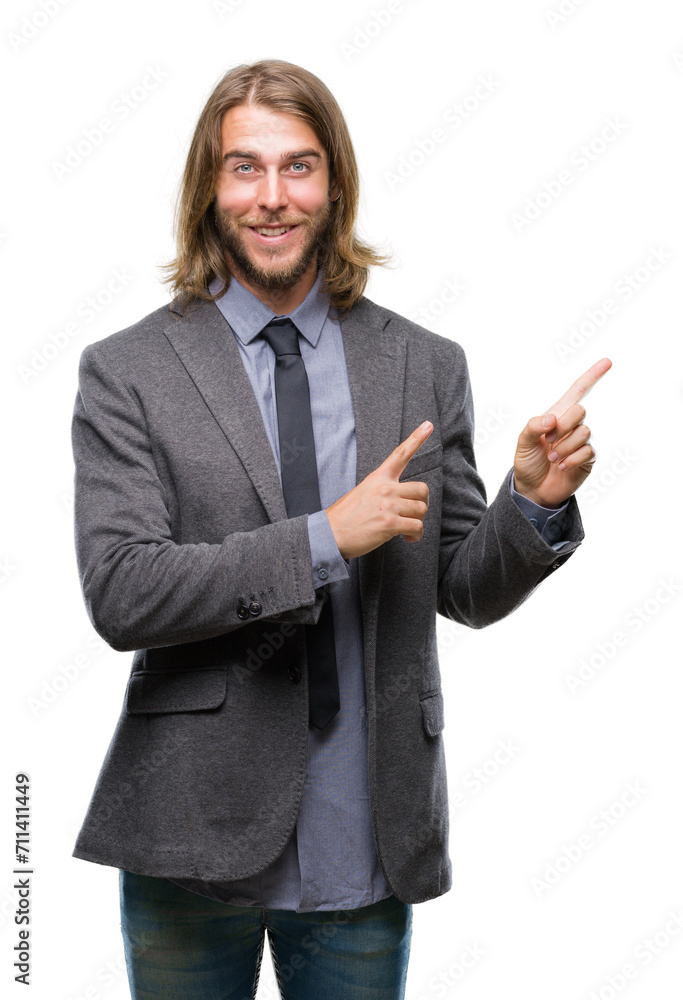 Young handsome business man with long hair over isolated background smiling and looking at the camera pointing with two hands and fingers to the side. Young handsome business man with long hair over isolated background smiling and looking at the camera pointing with two hands and fingers to the side.