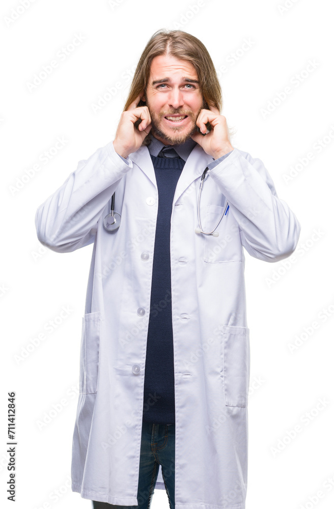 Young handsome doctor man with long hair over isolated background covering ears with fingers with annoyed expression for the noise of loud music. Deaf concept. Young handsome doctor man with long hair over isolated background covering ears with fingers with annoyed expression for the noise of loud music. Deaf concept.