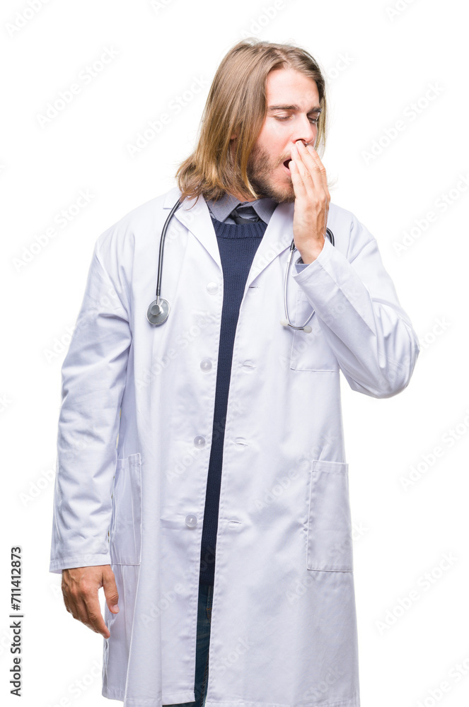 Young handsome doctor man with long hair over isolated background bored yawning tired covering mouth with hand. Restless and sleepiness. Young handsome doctor man with long hair over isolated background bored yawning tired covering mouth with hand. Restless and sleepiness.