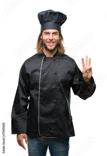 Young handsome cook man with long hair over isolated background showing and pointing up with fingers number three while smiling confident and happy.