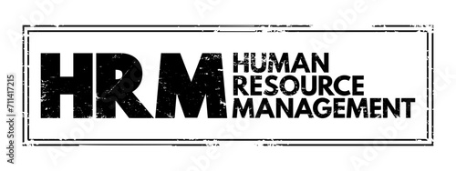 HRM - Human Resource Management is the strategic approach to the effective and efficient management of people in a company or organization, acronym business concept stamp