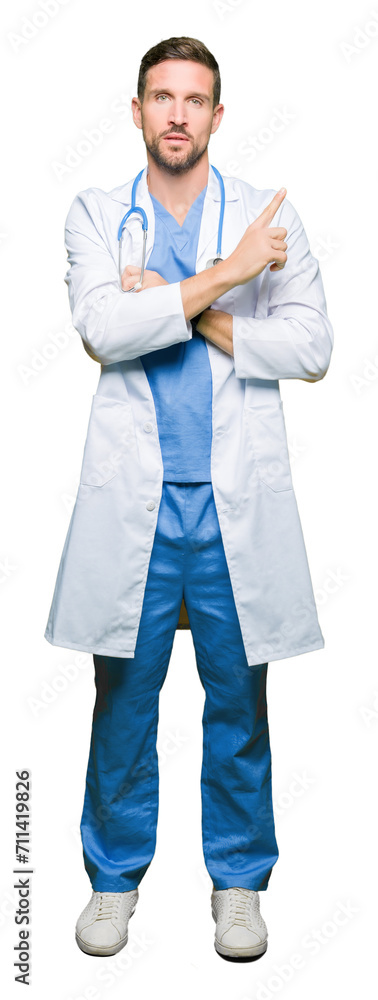 Handsome doctor man wearing medical uniform over isolated background Pointing with hand finger to the side showing advertisement, serious and calm face Handsome doctor man wearing medical uniform over isolated background Pointing with hand finger to the side showing advertisement, serious and calm face