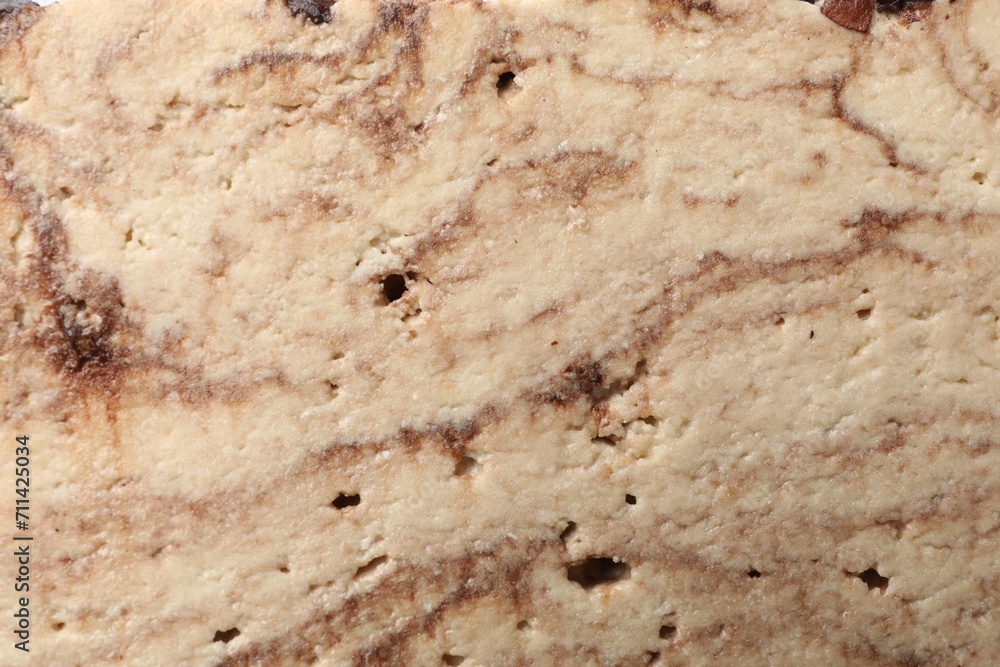 Tasty chocolate halva as background, closeup view Tasty chocolate halva as background, closeup view