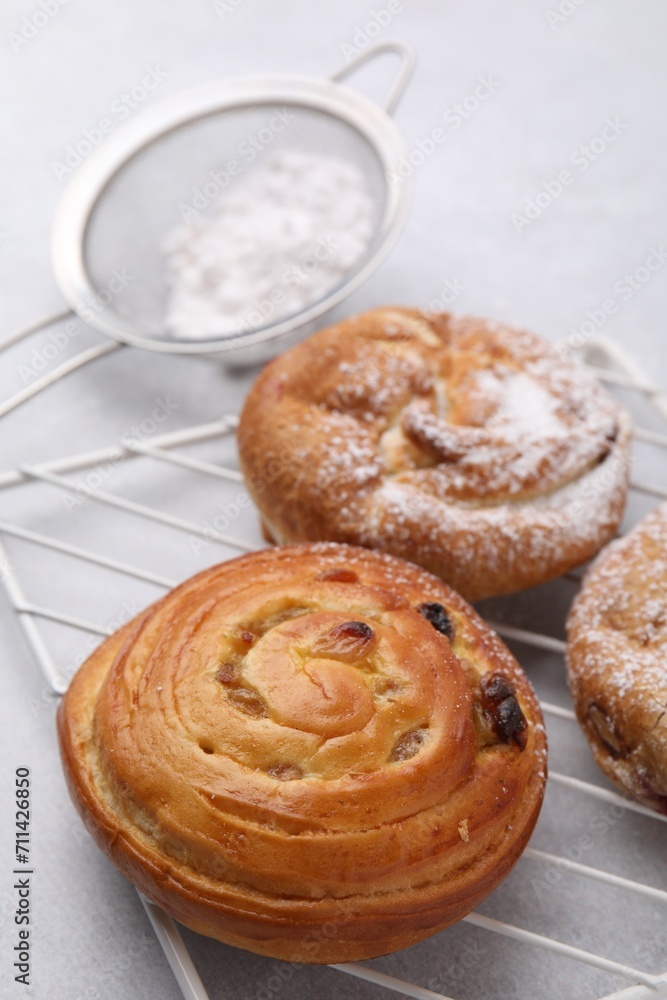 Different delicious rolls on light table. Sweet buns Different delicious rolls on light table. Sweet buns
