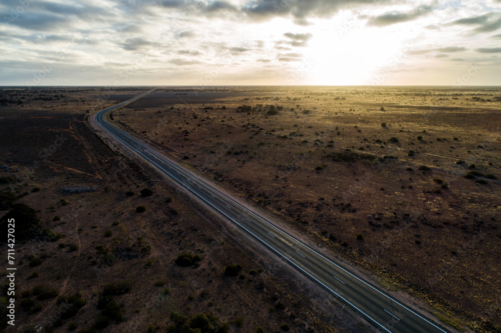 Aerial view of Eyre Highway and Nullarbor Plain near Cocklebiddy, Western Australia. Aerial view of Eyre Highway and Nullarbor Plain near Cocklebiddy, Western Australia.
