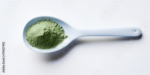 Instant green tea powder in light blue spoon isolated on white background Powdered matcha green tea in spoon Ai Generative