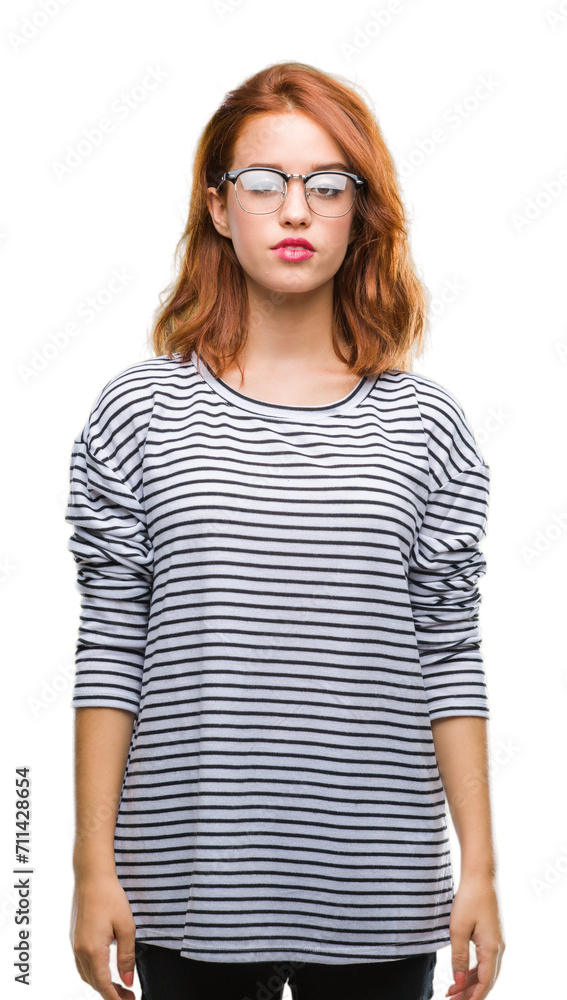 Young beautiful woman over isolated background wearing glasses with serious expression on face. Simple and natural looking at the camera. Young beautiful woman over isolated background wearing glasses with serious expression on face. Simple and natural looking at the camera.