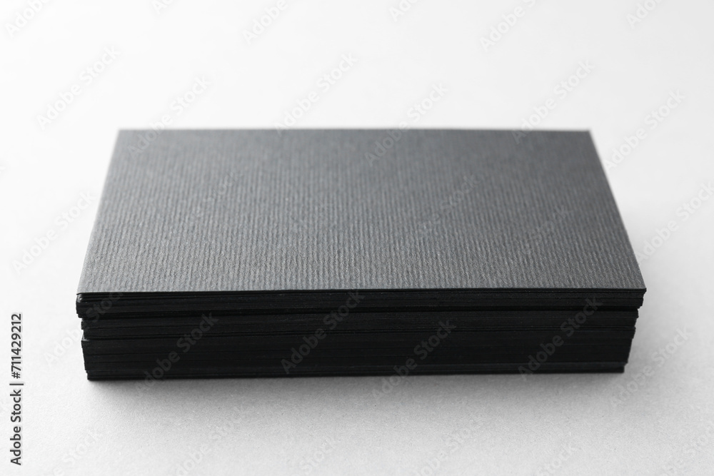 Blank black business cards on white table, closeup. Mockup for design Blank black business cards on white table, closeup. Mockup for design