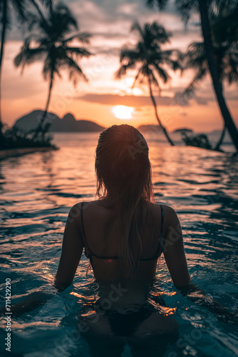 silhouette of a woman in a swimsuit on the background of the ocean.