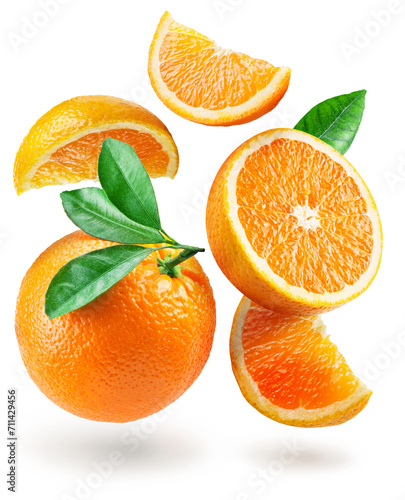 Ripe orange fruits and orange slices levitating in air on white background. File contains clipping path.