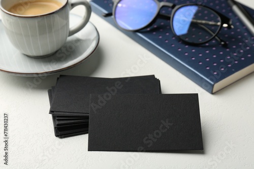 Wallpaper Mural Blank black business cards, notebook, glasses and cup of coffee on white table, closeup. Mockup for design Torontodigital.ca