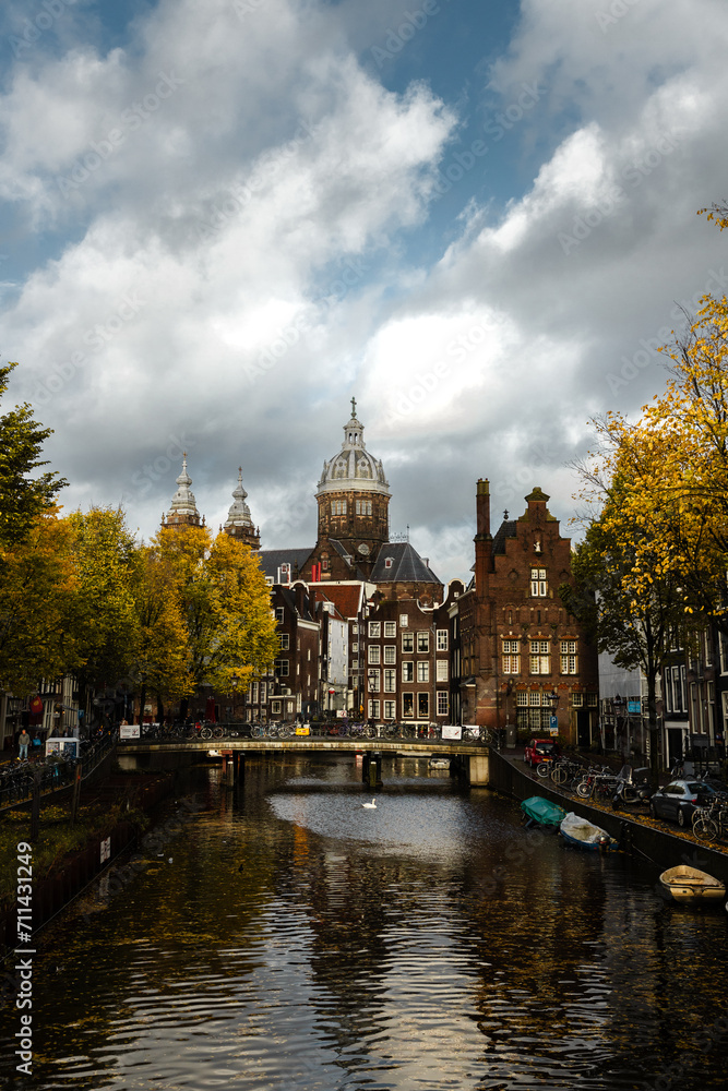 Amsterdam canals with autumn colours and old buildings cloudy day_1