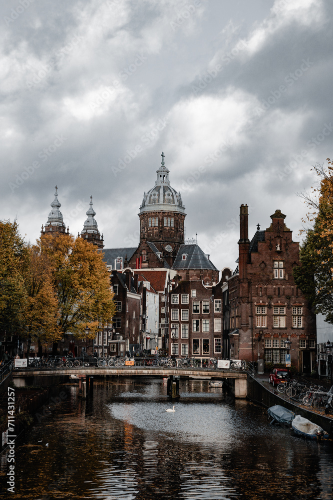 Amsterdam canals with autumn colours and old buildings cloudy day_2
