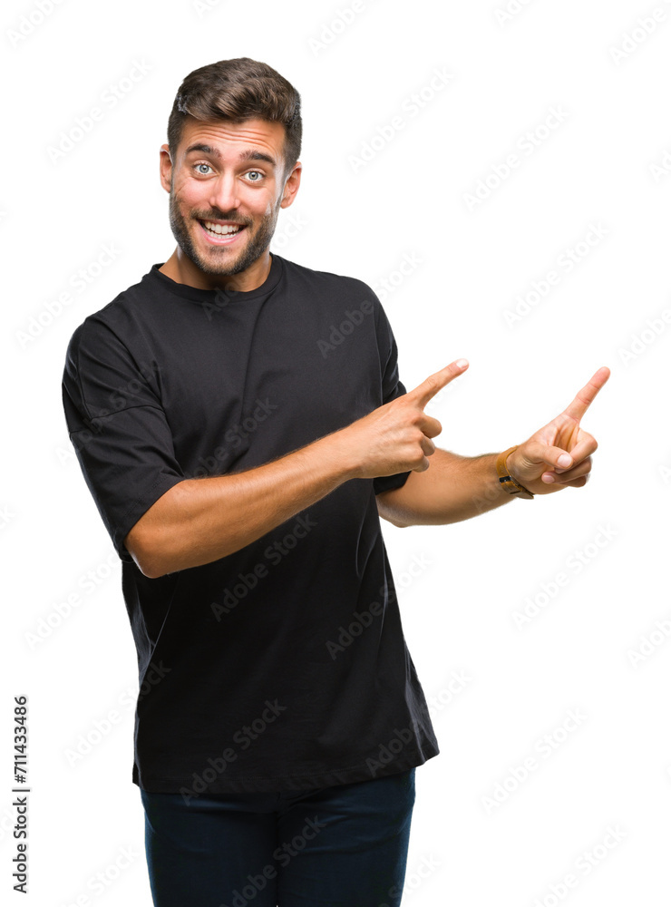 Young handsome man over isolated background smiling and looking at the camera pointing with two hands and fingers to the side. Young handsome man over isolated background smiling and looking at the camera pointing with two hands and fingers to the side.