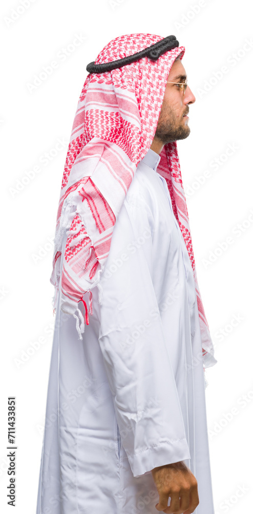 Young handsome man wearing keffiyeh over isolated background looking to side, relax profile pose with natural face with confident smile.