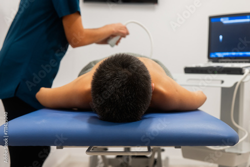 Physiotherapy session with a patient receiving ultrasound therapy photo