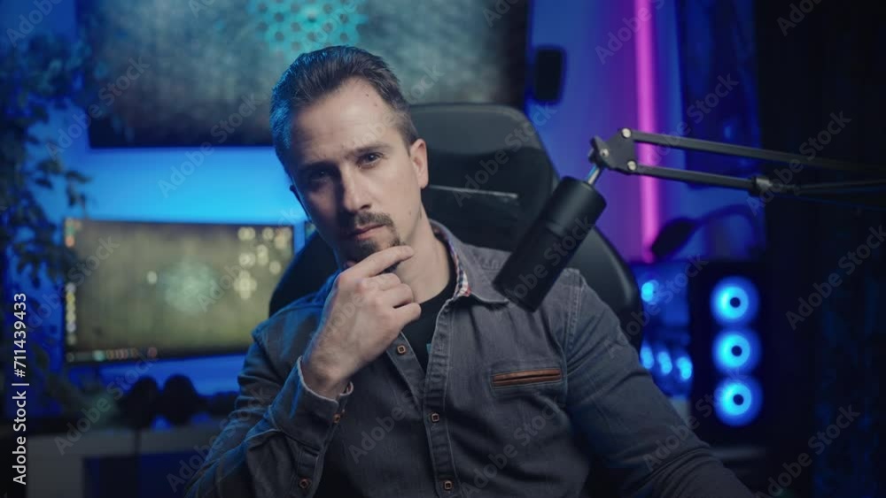 Tech influencer looking into the camera thinking and stroke the beard 4K Tech influencer looking into the camera thinking and stroke the beard 4K