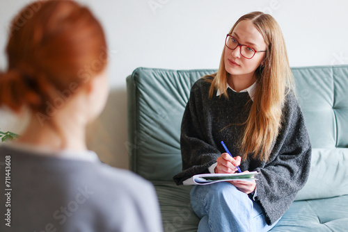 portrait of a psychologist coach in consultation with a client