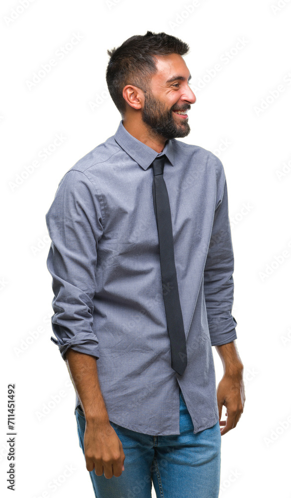 Adult hispanic business man over isolated background looking away to side with smile on face, natural expression. Laughing confident. Adult hispanic business man over isolated background looking away to side with smile on face, natural expression. Laughing confident.