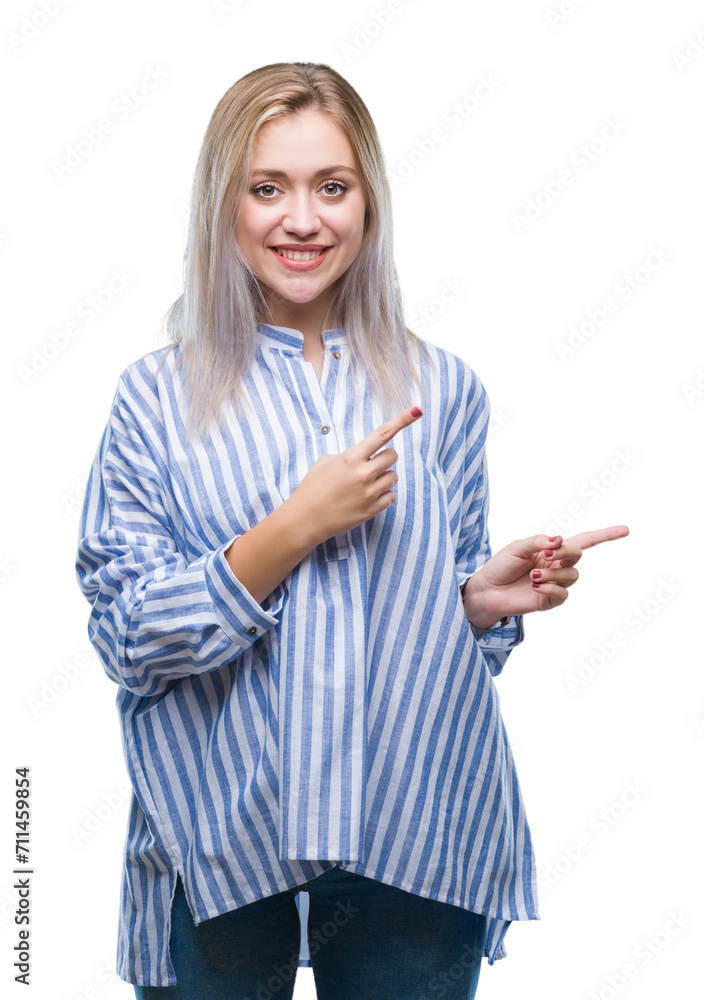 Young blonde woman over isolated background smiling and looking at the camera pointing with two hands and fingers to the side. Young blonde woman over isolated background smiling and looking at the camera pointing with two hands and fingers to the side.