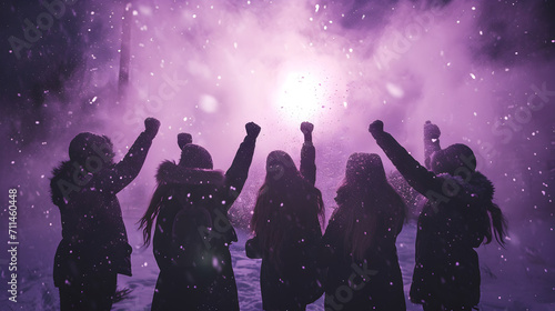 Photograph of a group of women closing fist of up high in a winter park snowing. Purple smoke color palette. Women's day. 8M