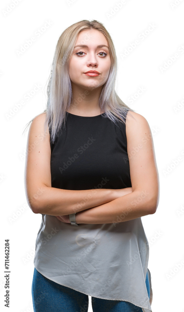 Young blonde woman over isolated background with serious expression on face. Simple and natural looking at the camera. Young blonde woman over isolated background with serious expression on face. Simple and natural looking at the camera.